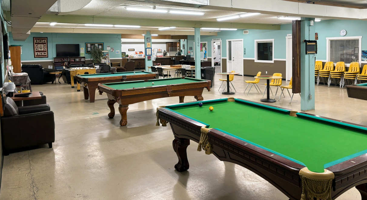 Community space featuring pool tables inside a Salvation Army facility.