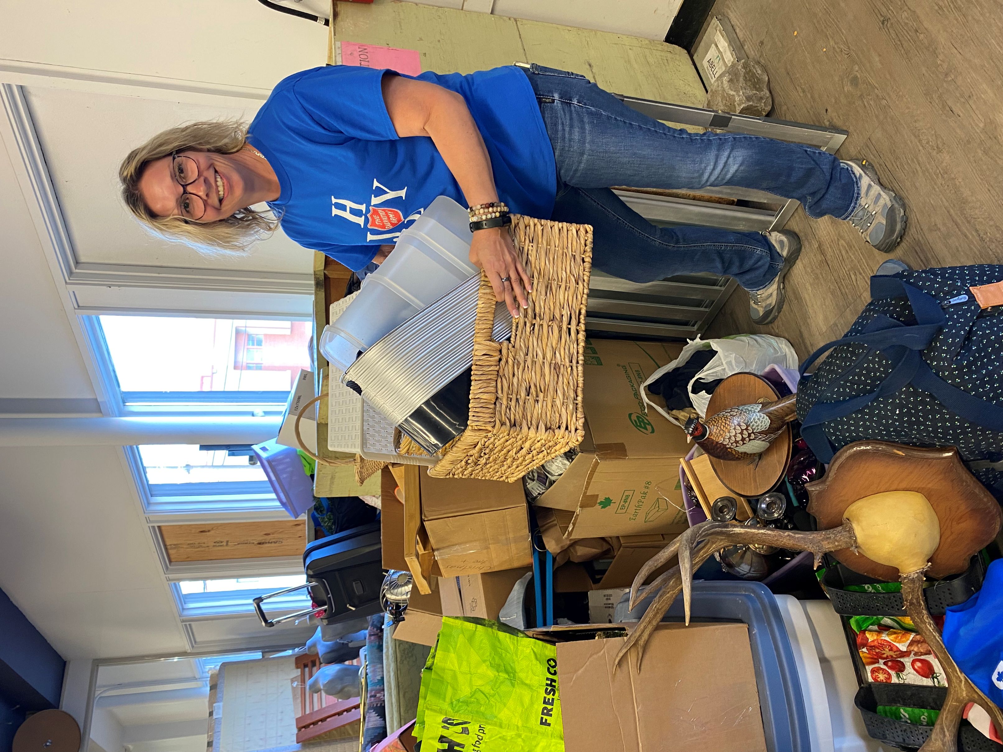 Employee smiling with donations